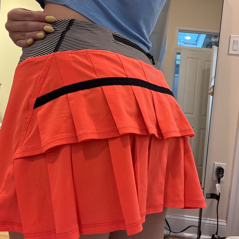 Lululemon Pace Setter Skirt. Bright orange and stripe size 6